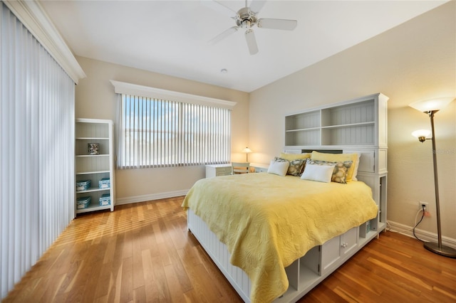 bedroom featuring ceiling fan and hardwood / wood-style flooring