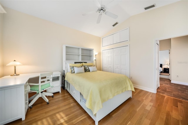 bedroom featuring vaulted ceiling, ceiling fan, a closet, and hardwood / wood-style floors