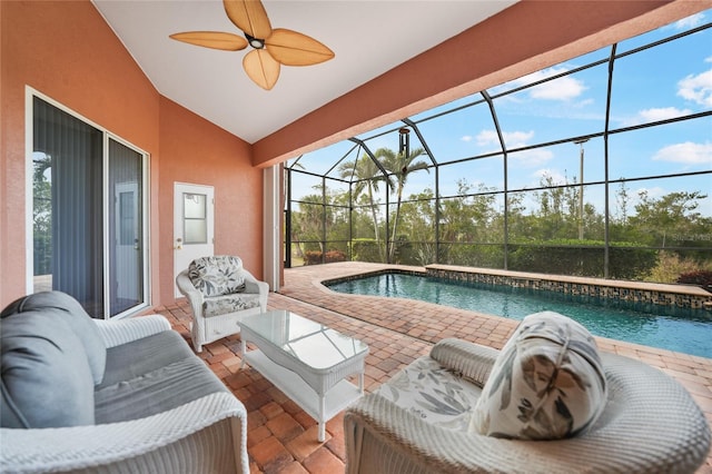 view of swimming pool with a patio area and glass enclosure