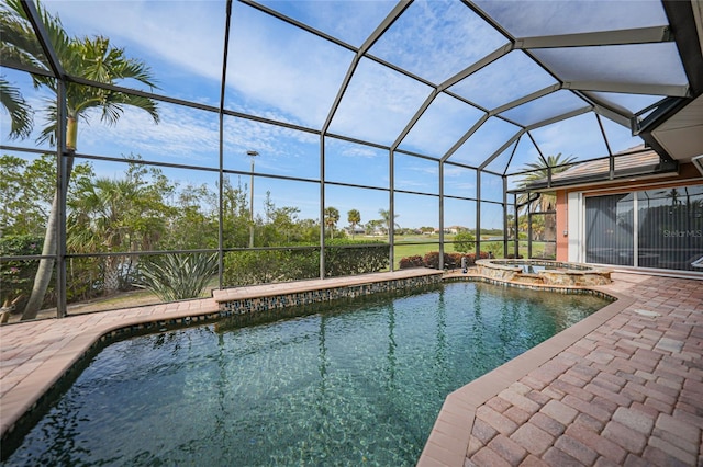 view of pool with an in ground hot tub, a lanai, and a patio area