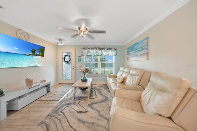 living room with light hardwood / wood-style floors, ornamental molding, and ceiling fan