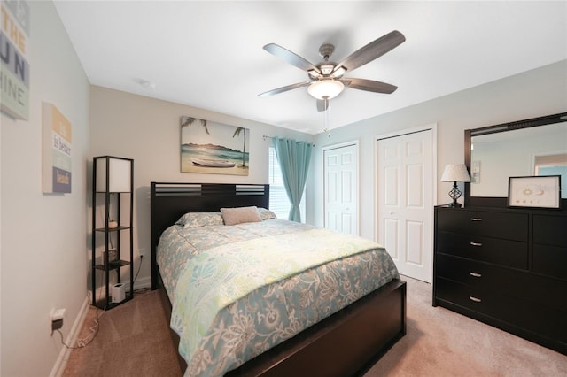 bedroom featuring ceiling fan and light colored carpet