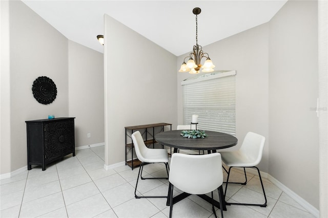 dining area with light tile patterned floors and a chandelier