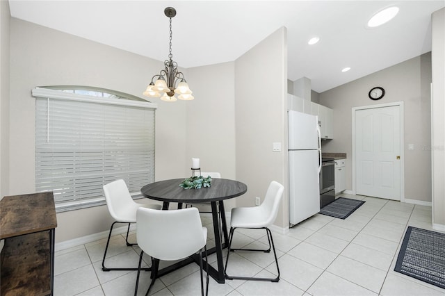 dining room featuring vaulted ceiling, light tile patterned flooring, and a chandelier