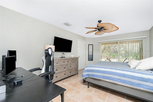 bedroom with ceiling fan and light tile patterned floors