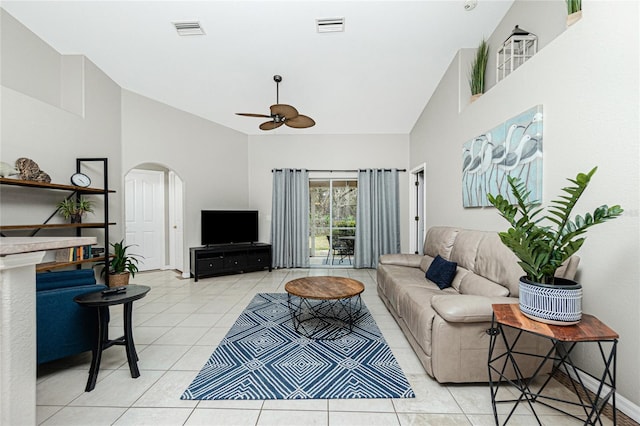 living room with ceiling fan, light tile patterned floors, and high vaulted ceiling