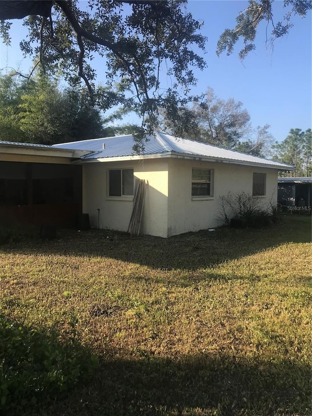 rear view of house with a lawn