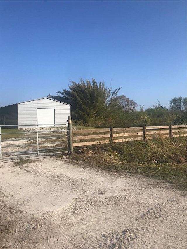 exterior space featuring an outbuilding and a rural view