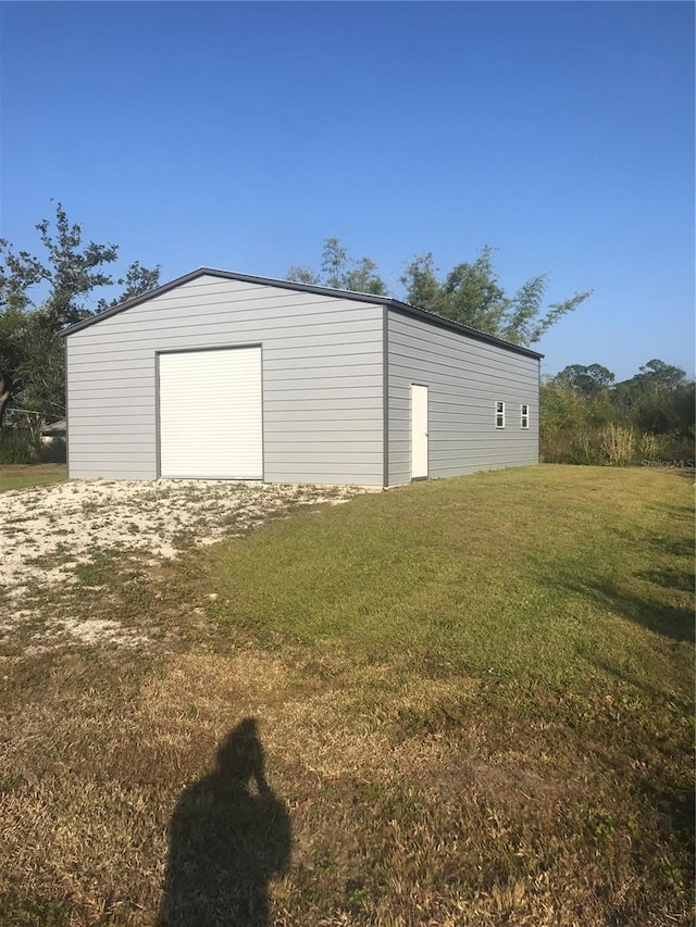 garage featuring a yard