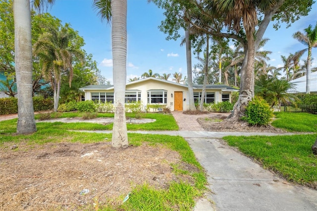 view of front of home with a front lawn