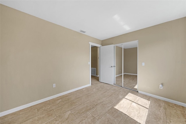 unfurnished bedroom featuring a closet