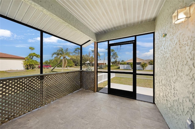 unfurnished sunroom with plenty of natural light