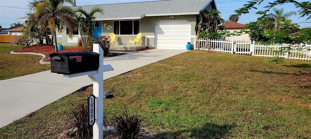 ranch-style home featuring a garage and a front lawn