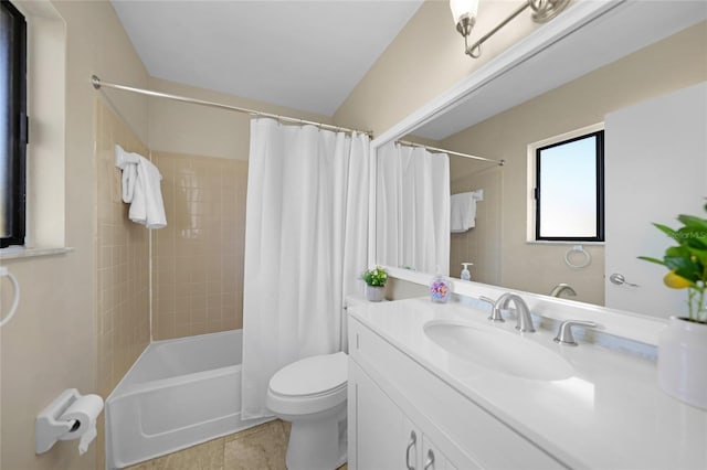 full bathroom featuring vanity, toilet, tile patterned flooring, and shower / bath combo with shower curtain