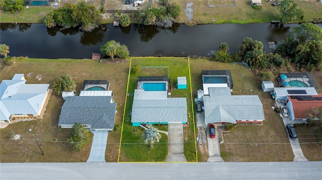 birds eye view of property featuring a water view