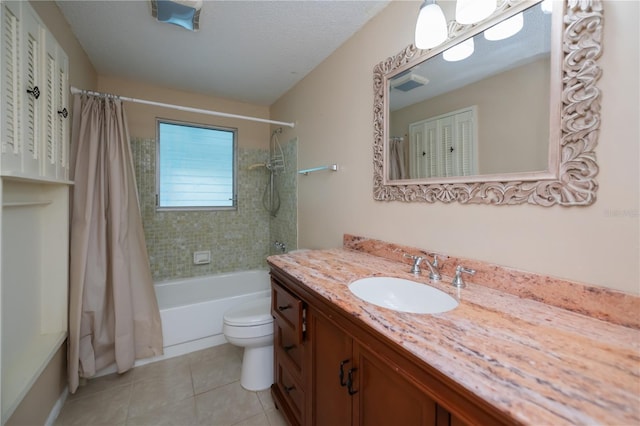 full bathroom with toilet, tile patterned flooring, shower / bathtub combination with curtain, a textured ceiling, and vanity