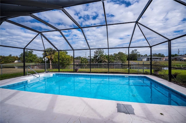 view of pool with a lanai and a patio