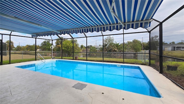 view of swimming pool with a lanai and a patio area