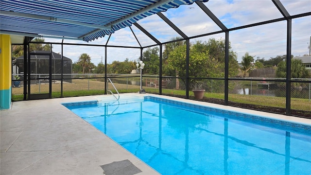 view of swimming pool with a lanai, a patio area, and a yard