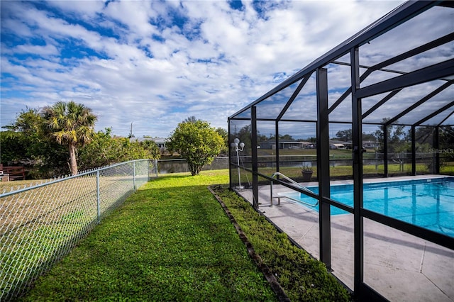 view of pool with a water view, a yard, and glass enclosure