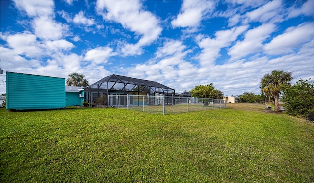 view of yard featuring glass enclosure