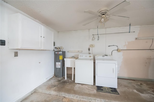 clothes washing area featuring water heater, ceiling fan, separate washer and dryer, a textured ceiling, and sink