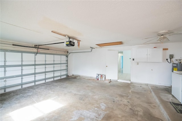 garage with a garage door opener and ceiling fan