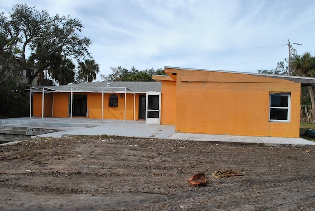 back of house featuring a patio area