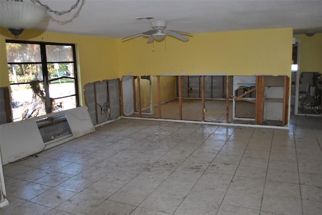 empty room featuring visible vents and a ceiling fan