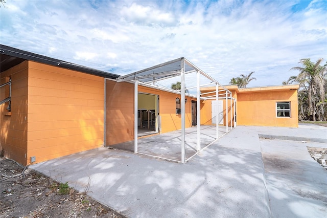 back of house with a patio area