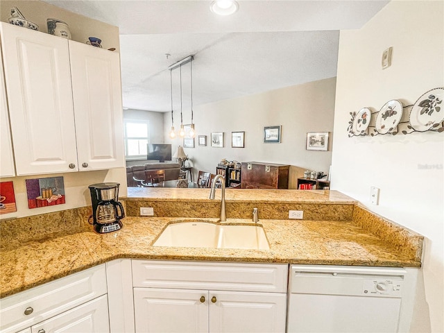 kitchen with dishwasher, sink, hanging light fixtures, white cabinets, and light stone counters