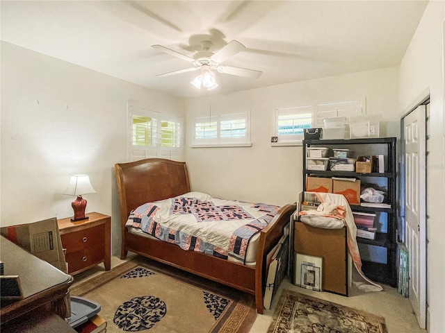 bedroom featuring ceiling fan and a closet