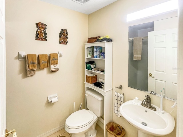 bathroom featuring sink and toilet