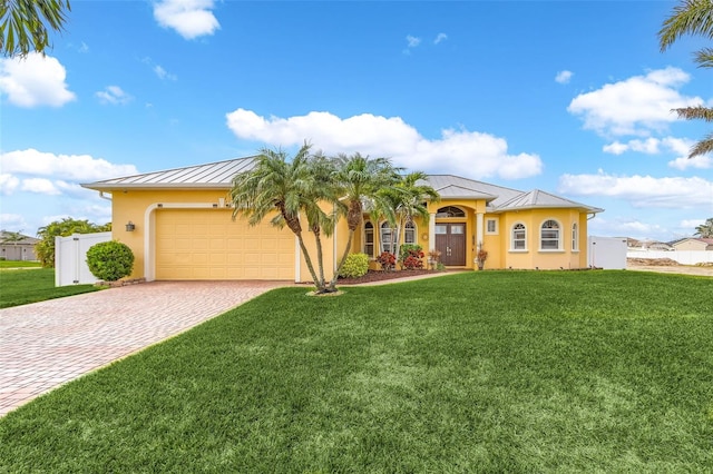 view of front facade featuring a garage and a front yard