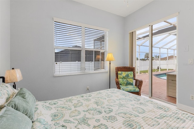 bedroom featuring access to outside and multiple windows