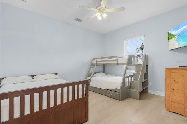 bedroom with ceiling fan and light wood-type flooring