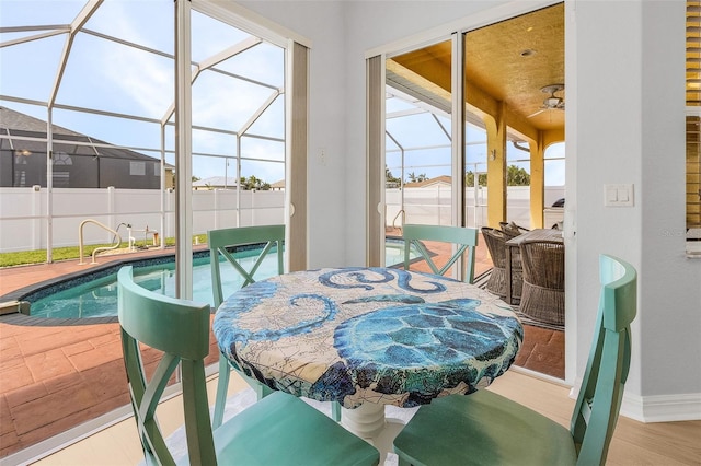 interior space featuring ceiling fan and a swimming pool