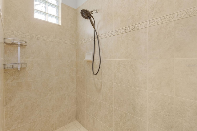 bathroom with a tile shower