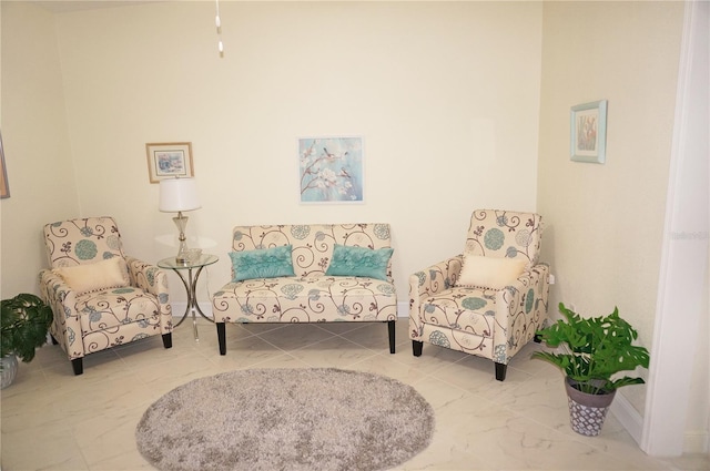 sitting room with tile patterned floors