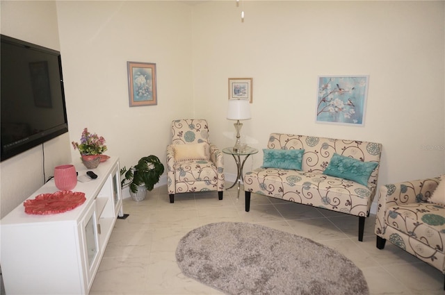 sitting room with light tile patterned flooring