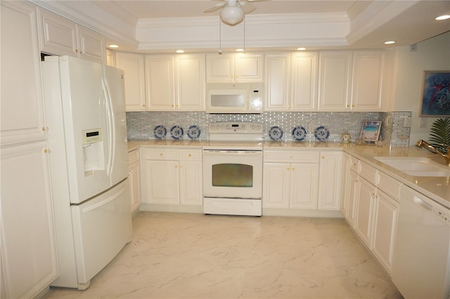 kitchen featuring backsplash, sink, white appliances, and ornamental molding