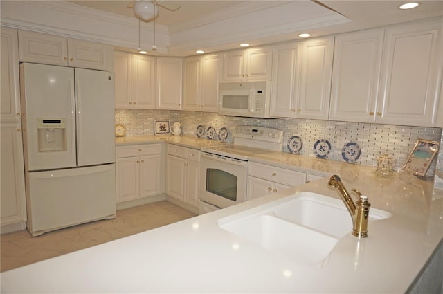 kitchen with white cabinetry, tasteful backsplash, white appliances, crown molding, and sink