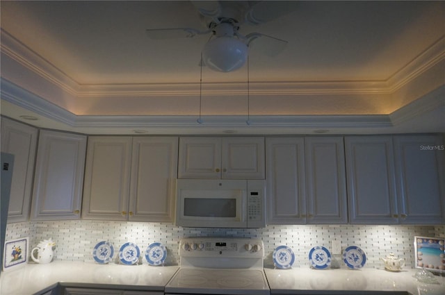 kitchen featuring tasteful backsplash, ceiling fan, white appliances, gray cabinetry, and ornamental molding