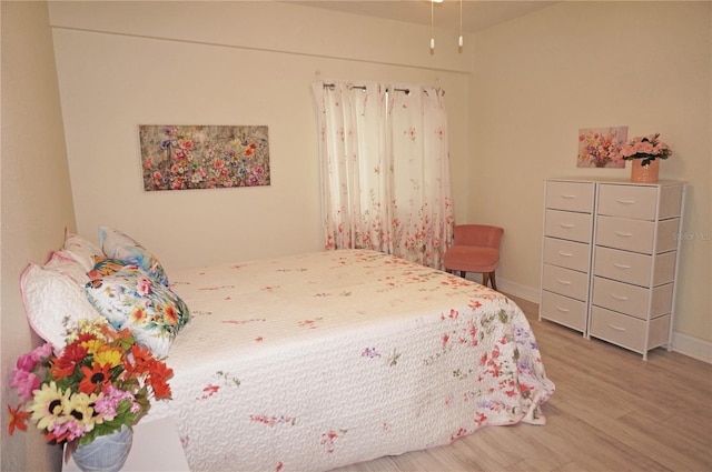 bedroom featuring hardwood / wood-style floors