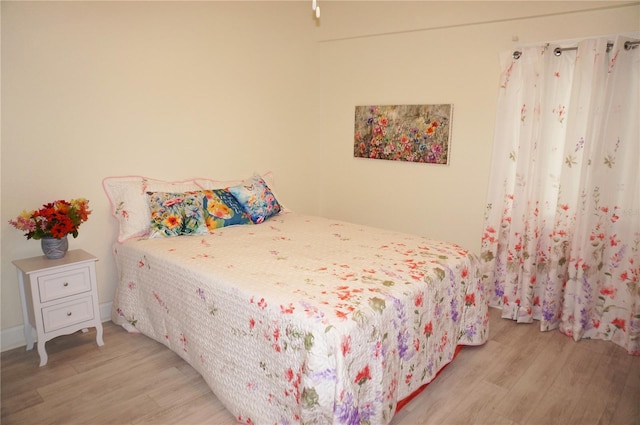 bedroom featuring light wood-type flooring