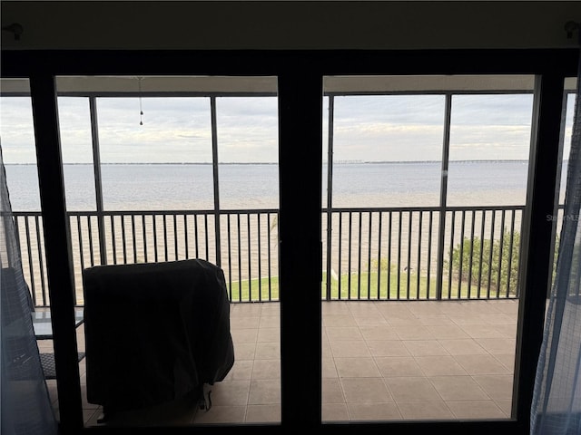 sunroom with a water view