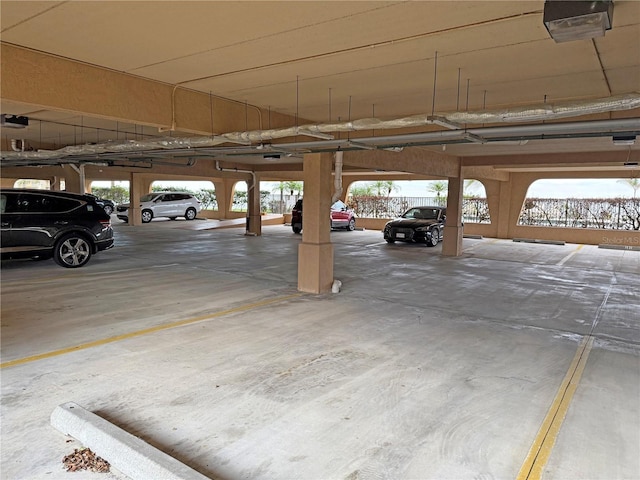 garage with a garage door opener and a carport