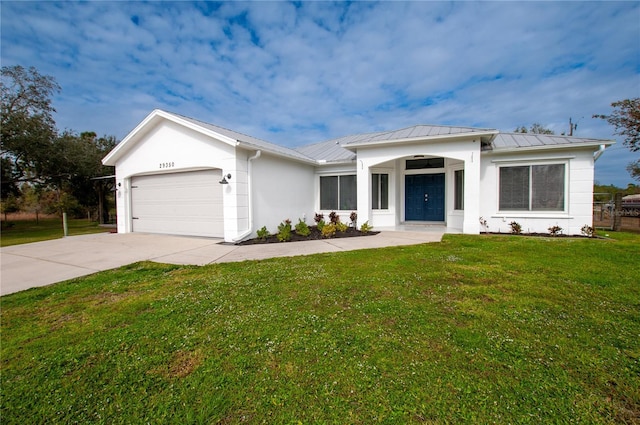 view of front facade featuring a front lawn and a garage