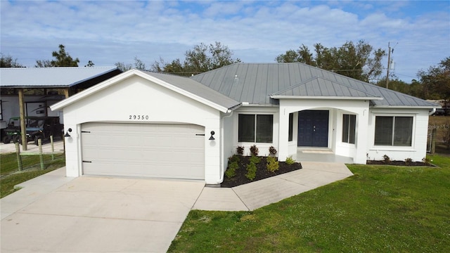 ranch-style home featuring a front yard and a garage