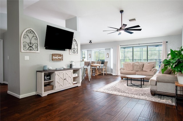 living room featuring ceiling fan, a wealth of natural light, and hardwood / wood-style flooring